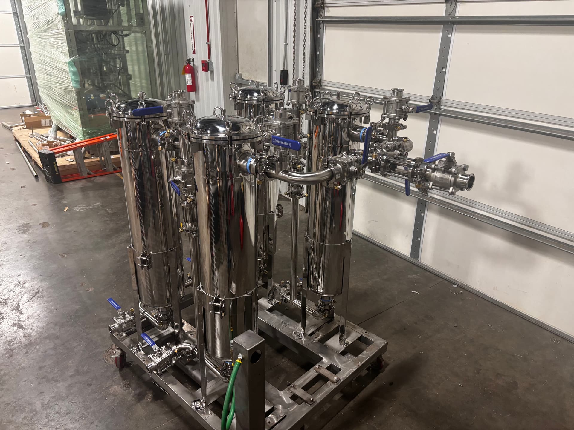 Stainless Chiller Piping, Filter Bag Skid, and Sanitary Manifold System Built Right image